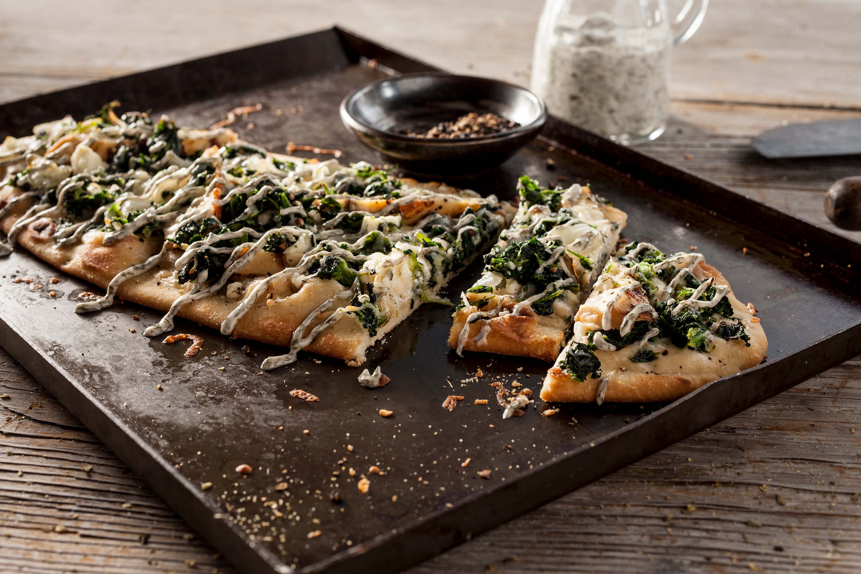 Chicken Spanakopita served on top of a Stonefire Oval Flatbread.